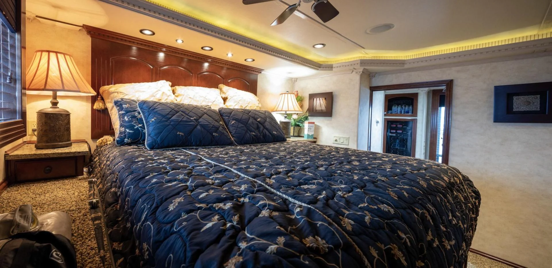 a bed with blue sheets aboard KNOT TIDE DOWN Yacht for Sale