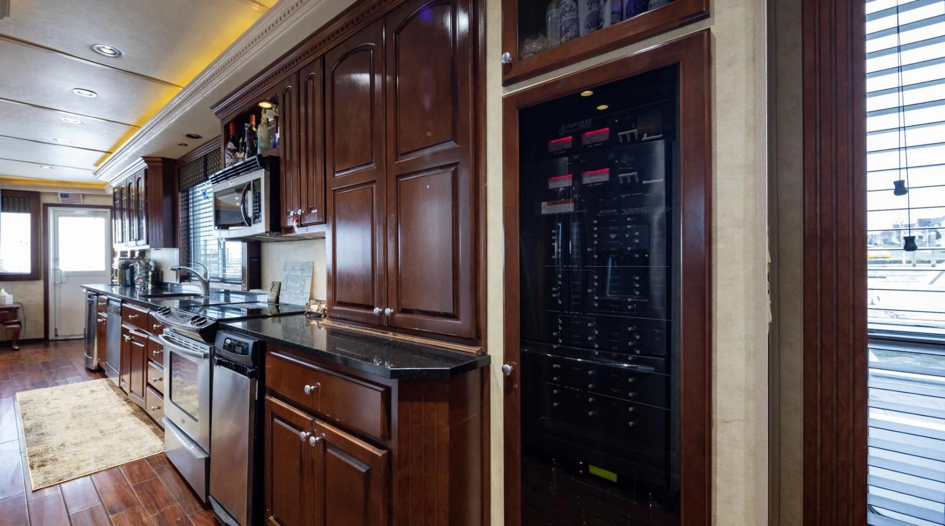 a kitchen with wooden cabinets aboard KNOT TIDE DOWN Yacht for Sale