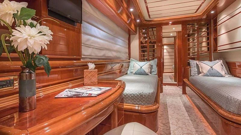 a living room with a table and couches aboard NOAH'S Yacht for Sale
