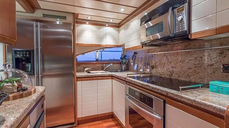 a kitchen with stainless steel appliances aboard NOAH'S Yacht for Sale