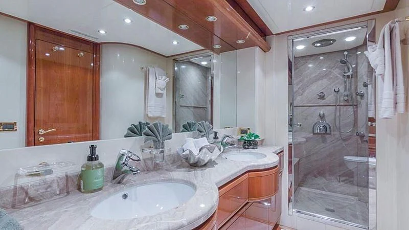 a bathroom with a large mirror aboard NOAH'S Yacht for Sale