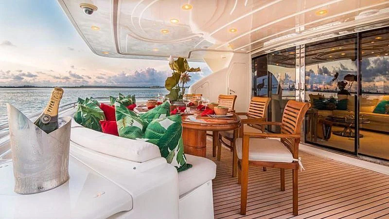 a room with a table and chairs aboard NOAH'S Yacht for Sale