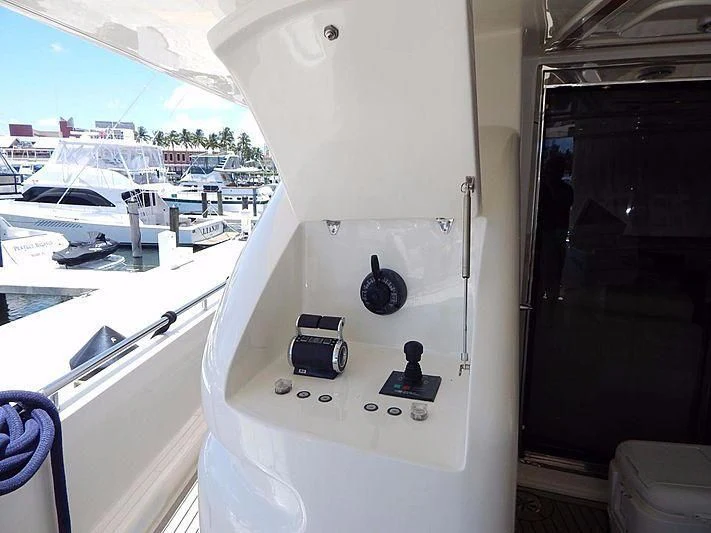 a white rectangular object with buttons and a screen on a window sill aboard NOAH'S Yacht for Sale