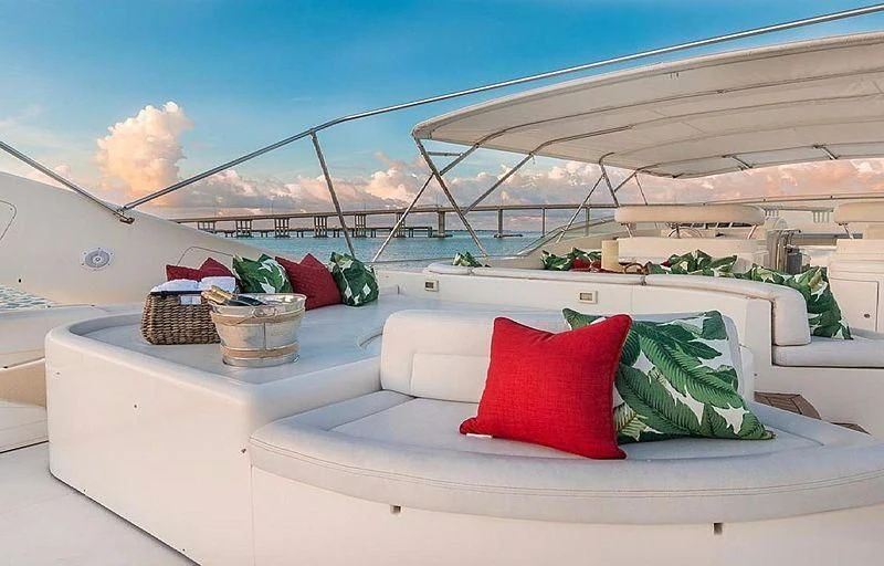 a white couch with pillows and blankets aboard NOAH'S Yacht for Sale