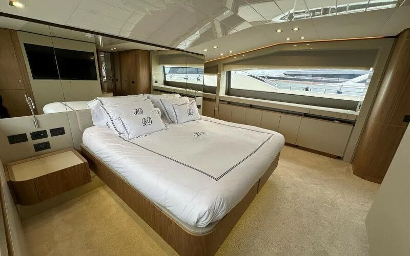 a room with a bed and a window aboard BLUE DODO Yacht for Sale
