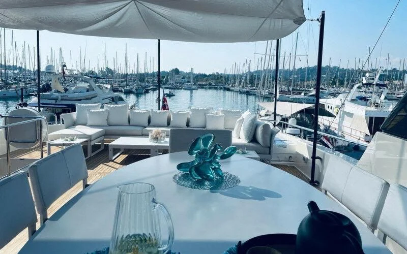 a large yacht with a statue aboard BLUE DODO Yacht for Sale