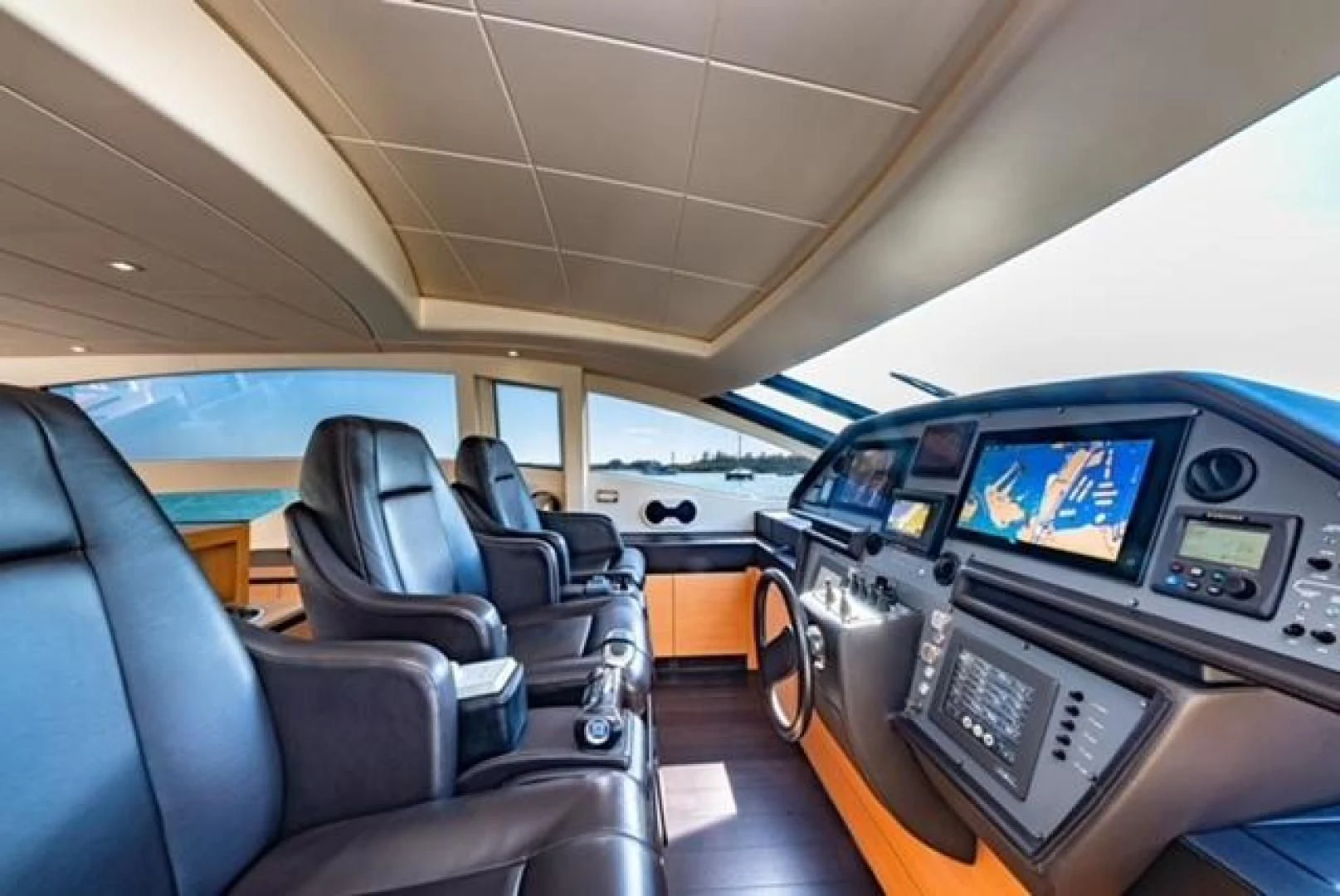 inside of a vehicle with seats and screens aboard RAW 2-HP Yacht for Sale