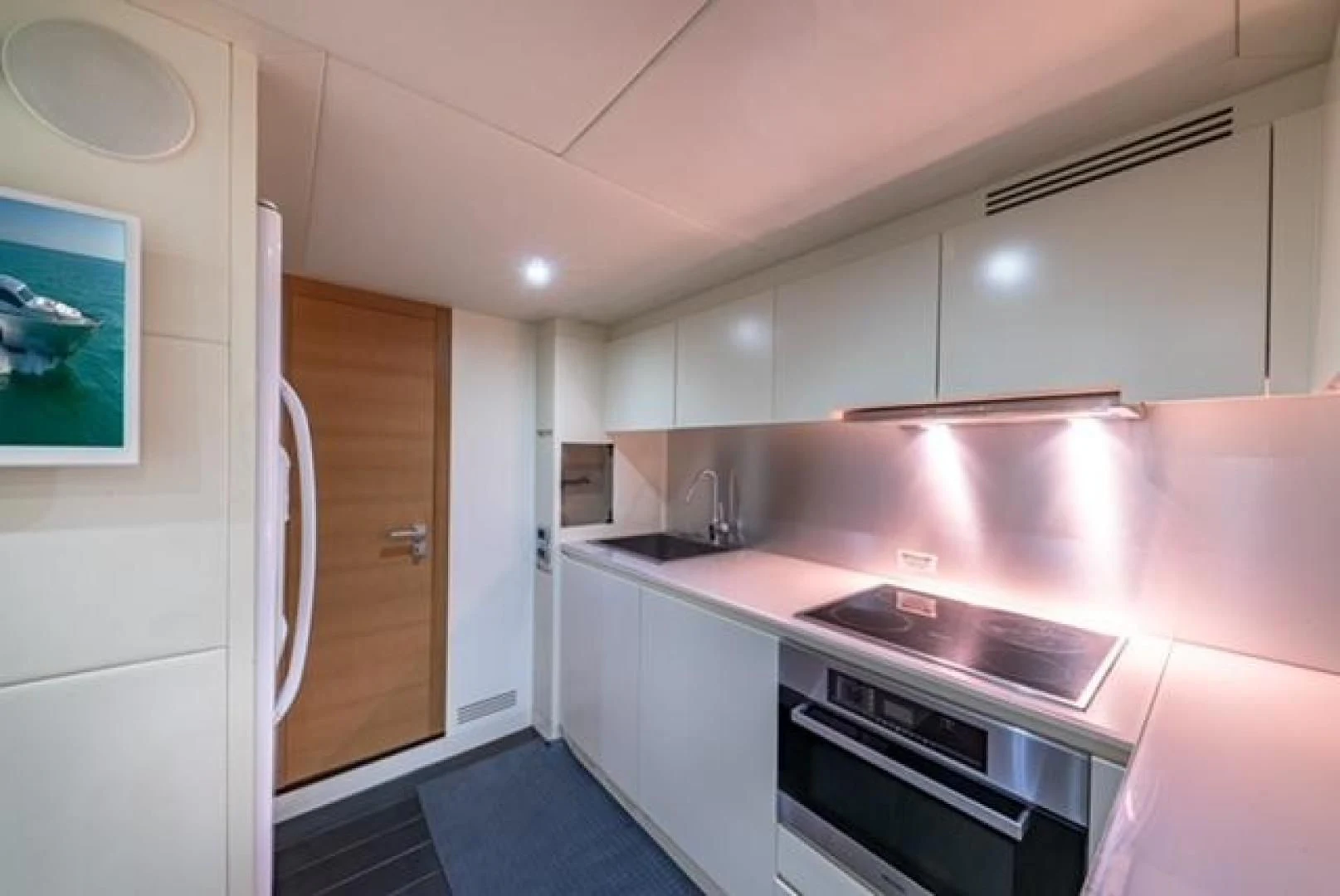 a kitchen with a pink counter aboard RAW 2-HP Yacht for Sale