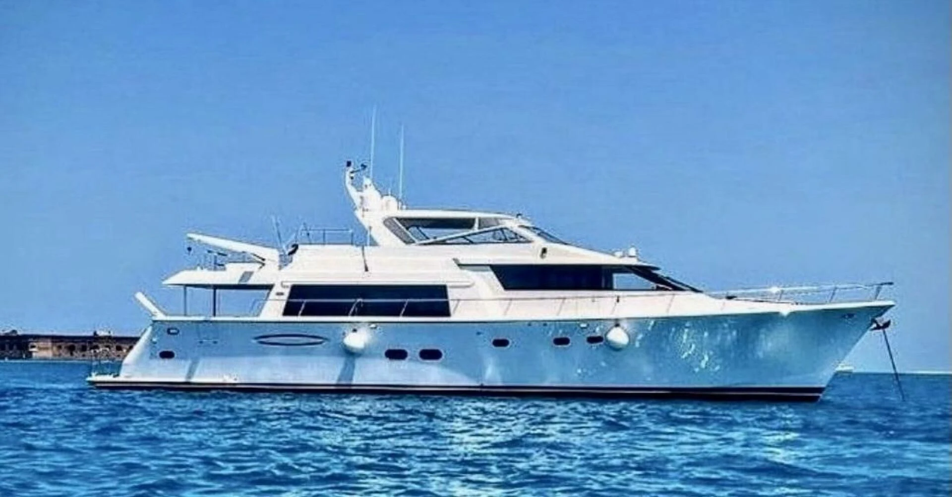 a white yacht in the water aboard LIFE'S A JOURNEY Yacht for Sale