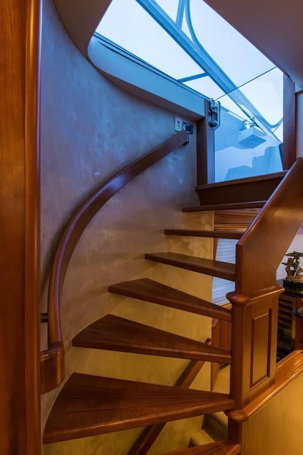 a wooden staircase with a glass ceiling aboard LIFE'S A JOURNEY Yacht for Sale