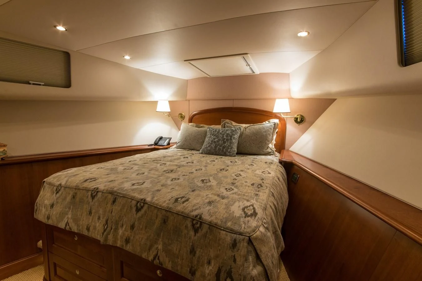 a bedroom with a bed and a desk aboard LIFE'S A JOURNEY Yacht for Sale