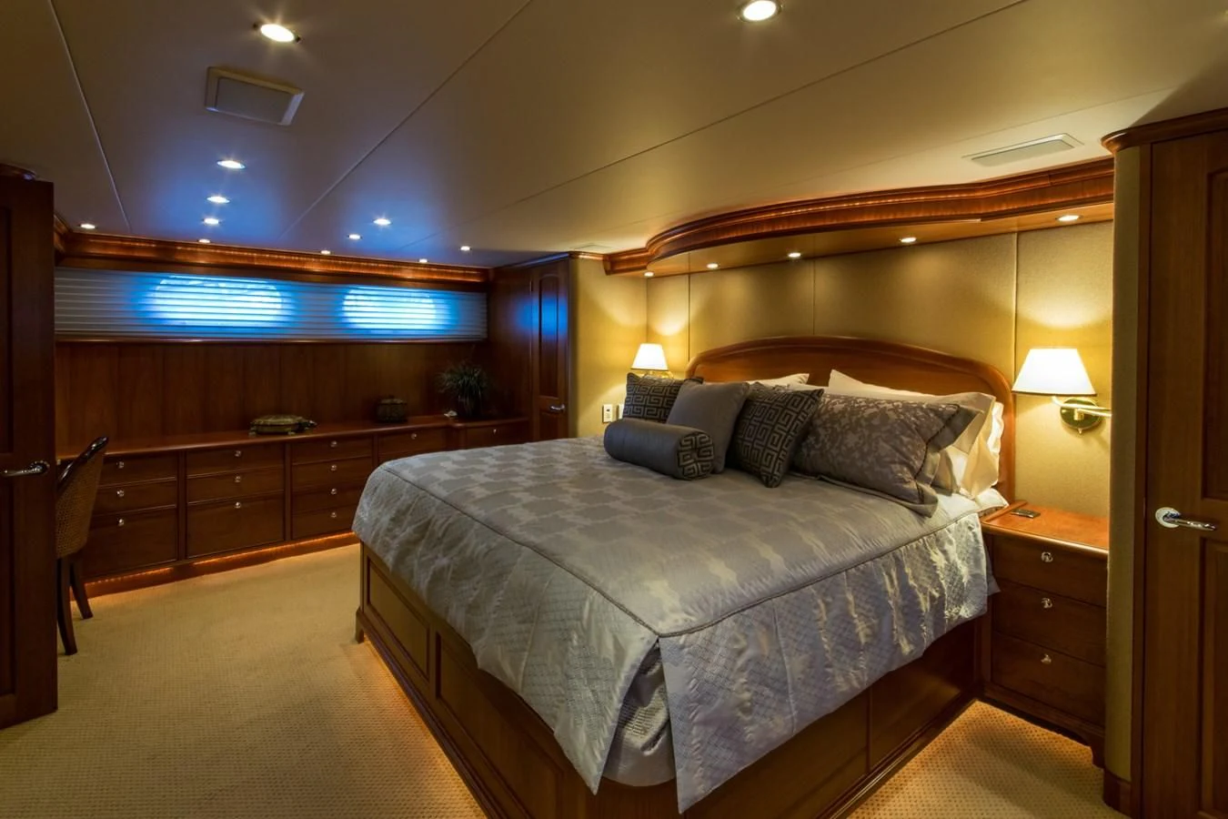 a bedroom with a bed and a desk aboard LIFE'S A JOURNEY Yacht for Sale