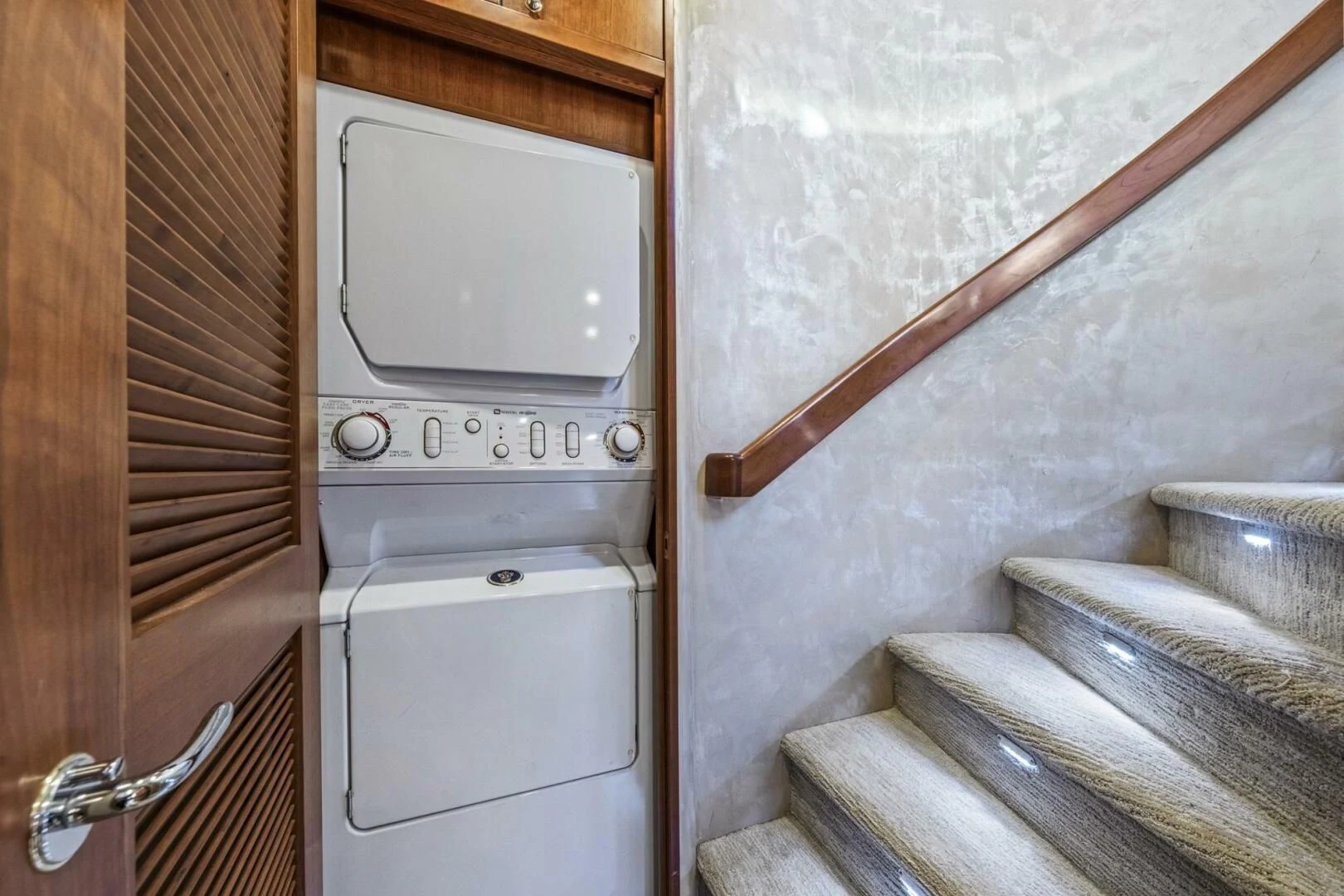 a white microwave oven on a wooden door aboard LIFE'S A JOURNEY Yacht for Sale