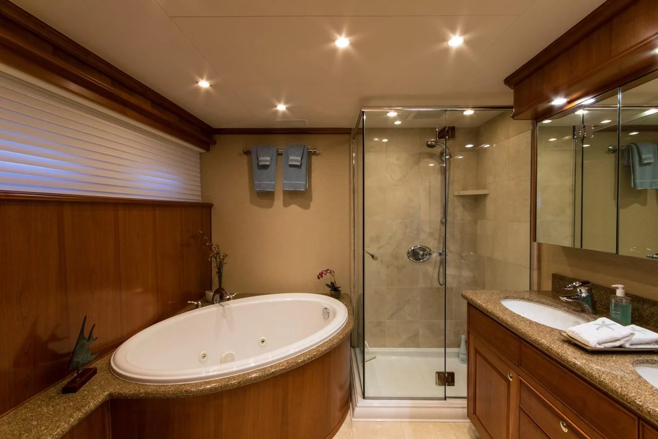 a bathroom with a glass shower aboard LIFE'S A JOURNEY Yacht for Sale