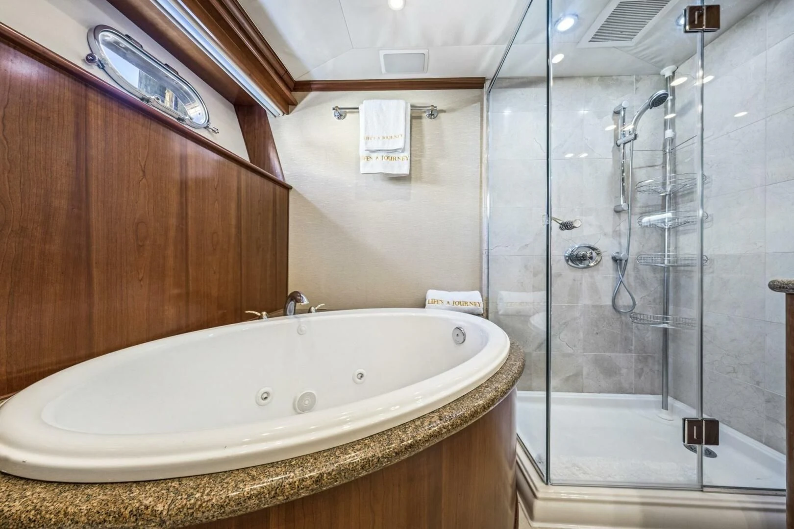 a bathroom with a large bathtub aboard LIFE'S A JOURNEY Yacht for Sale