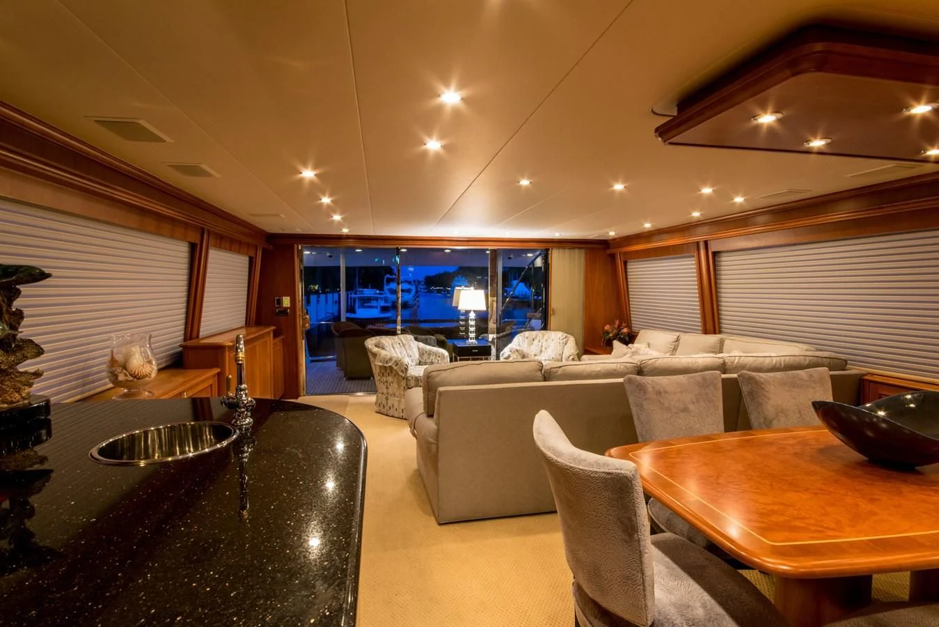 a living room with a large window aboard LIFE'S A JOURNEY Yacht for Sale
