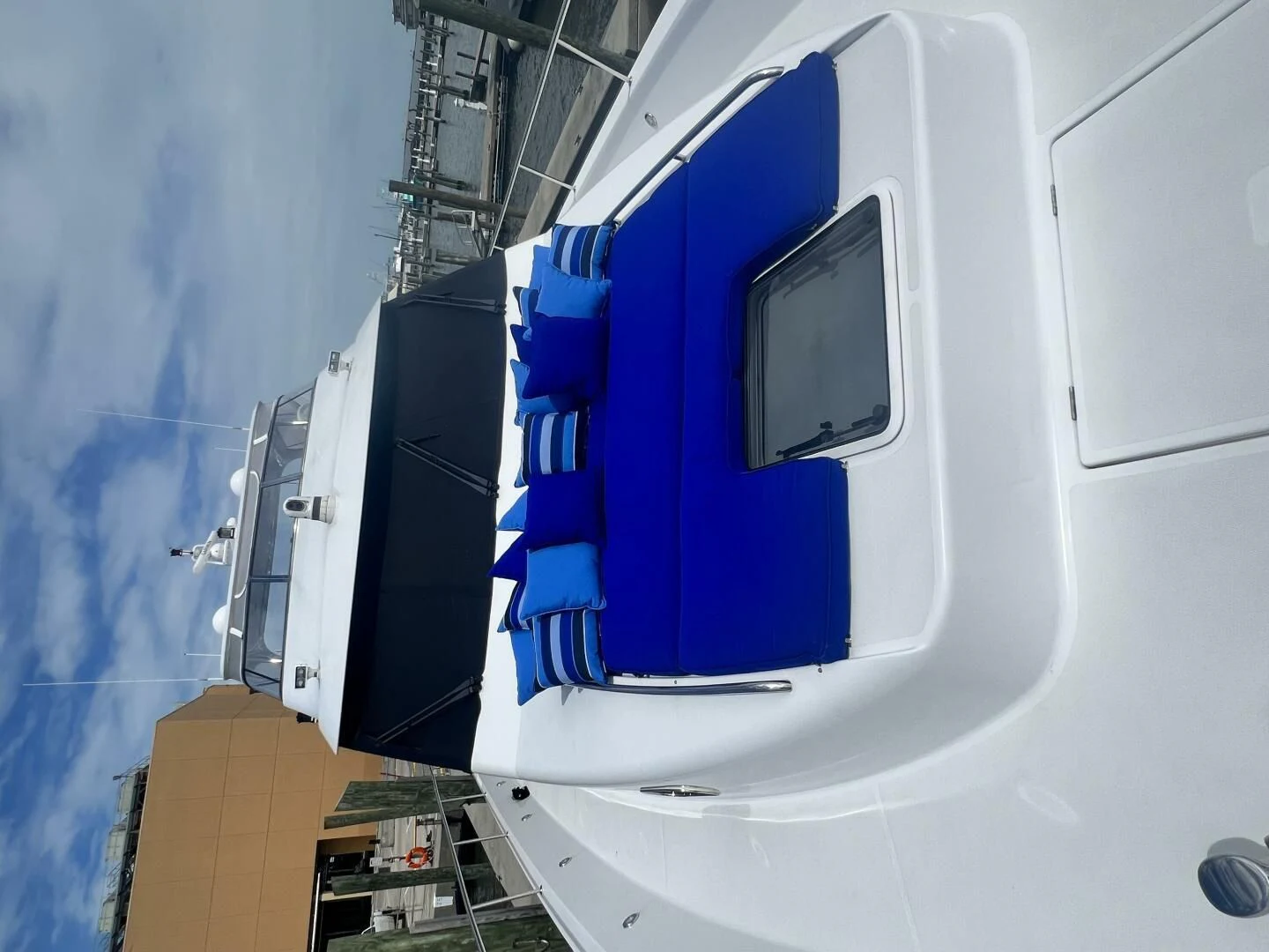a white vehicle with a blue hood aboard LIFE'S A JOURNEY Yacht for Sale