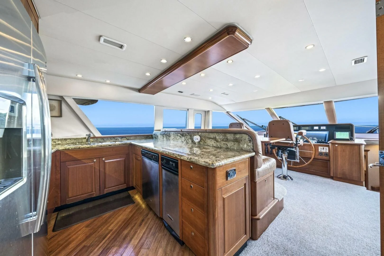 a large kitchen with a large island aboard LIFE'S A JOURNEY Yacht for Sale