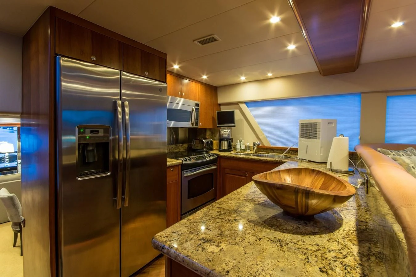 a kitchen with a stainless steel refrigerator aboard LIFE'S A JOURNEY Yacht for Sale
