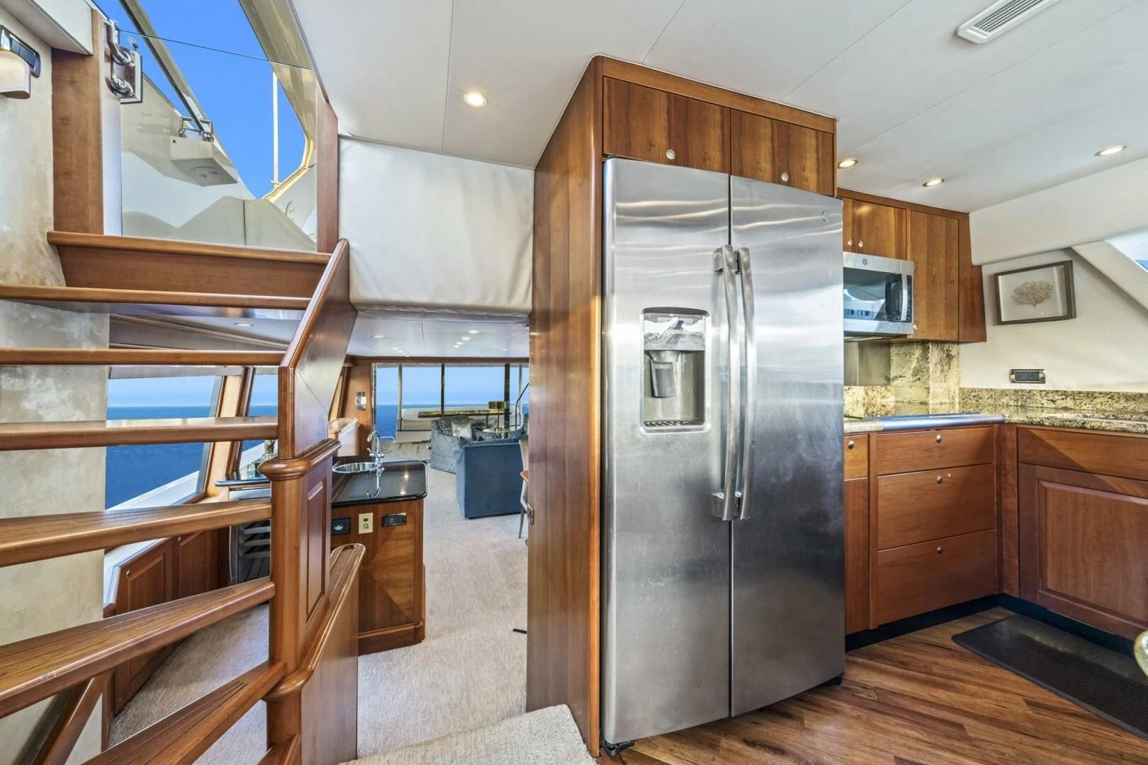 a kitchen with a stainless steel refrigerator aboard LIFE'S A JOURNEY Yacht for Sale