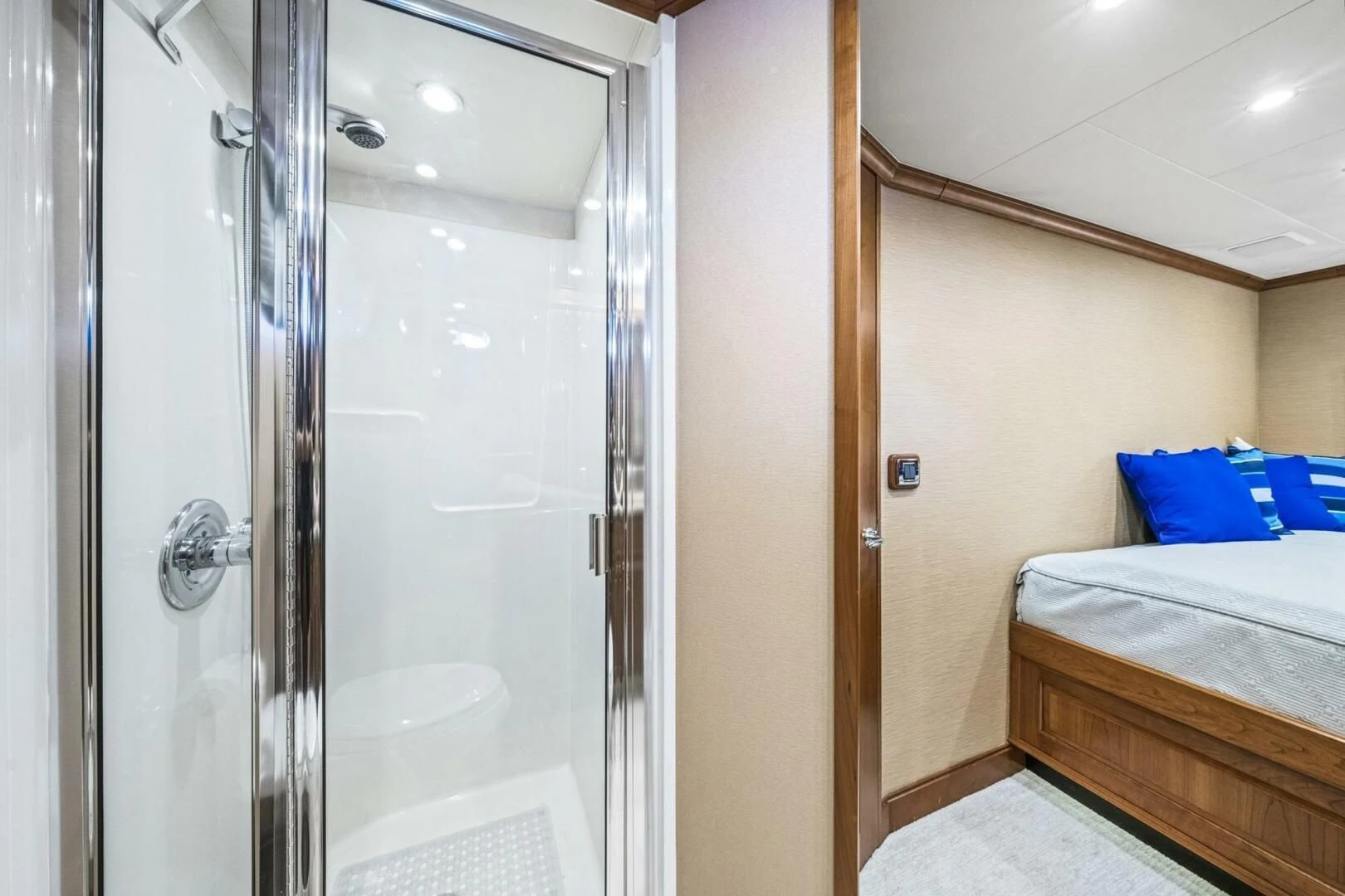 a bedroom with a glass shower aboard LIFE'S A JOURNEY Yacht for Sale