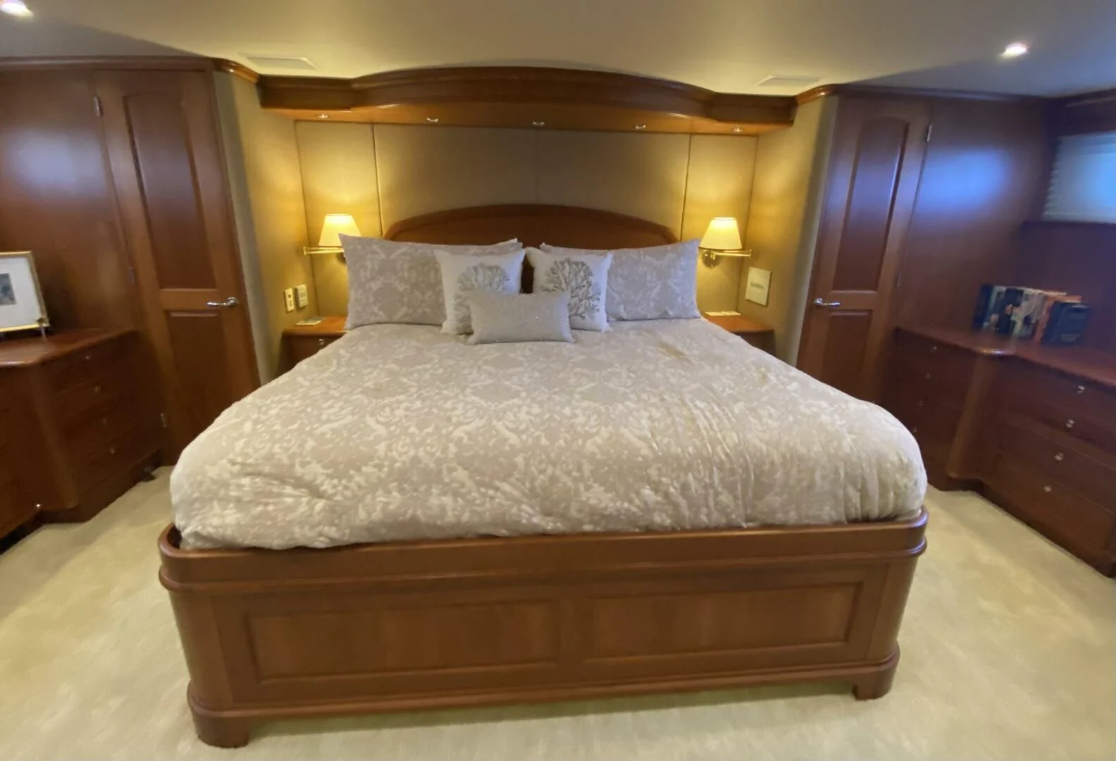 a bed with a white comforter aboard LIFE'S A JOURNEY Yacht for Sale