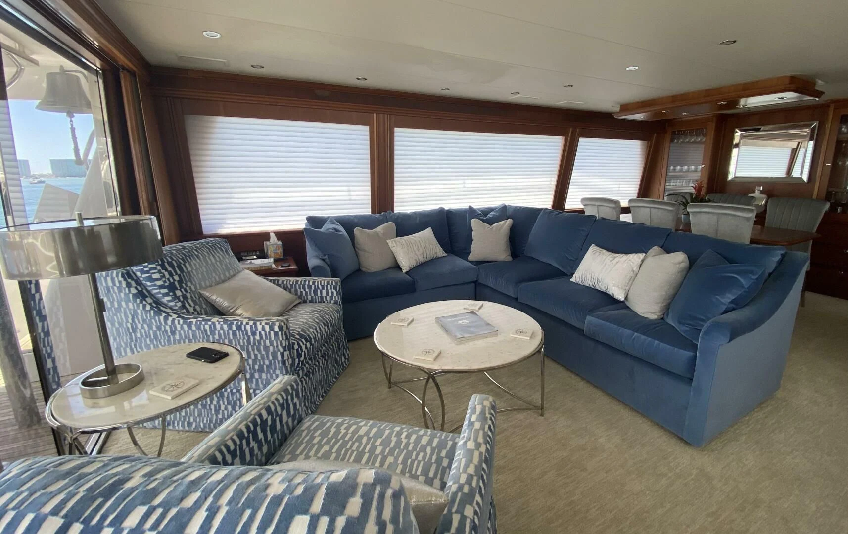 a living room with a blue couch aboard LIFE'S A JOURNEY Yacht for Sale
