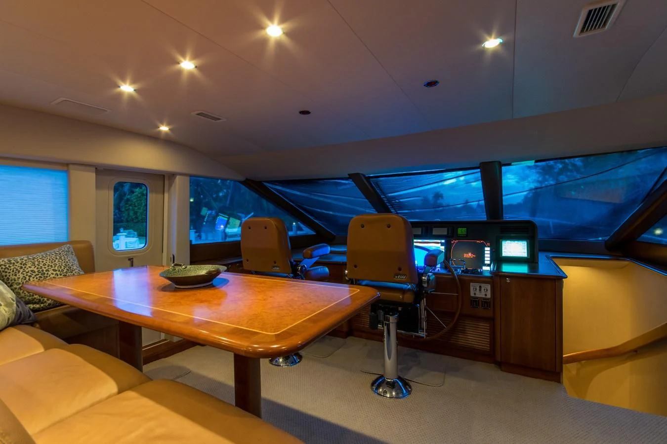 a room with a table and chairs aboard LIFE'S A JOURNEY Yacht for Sale