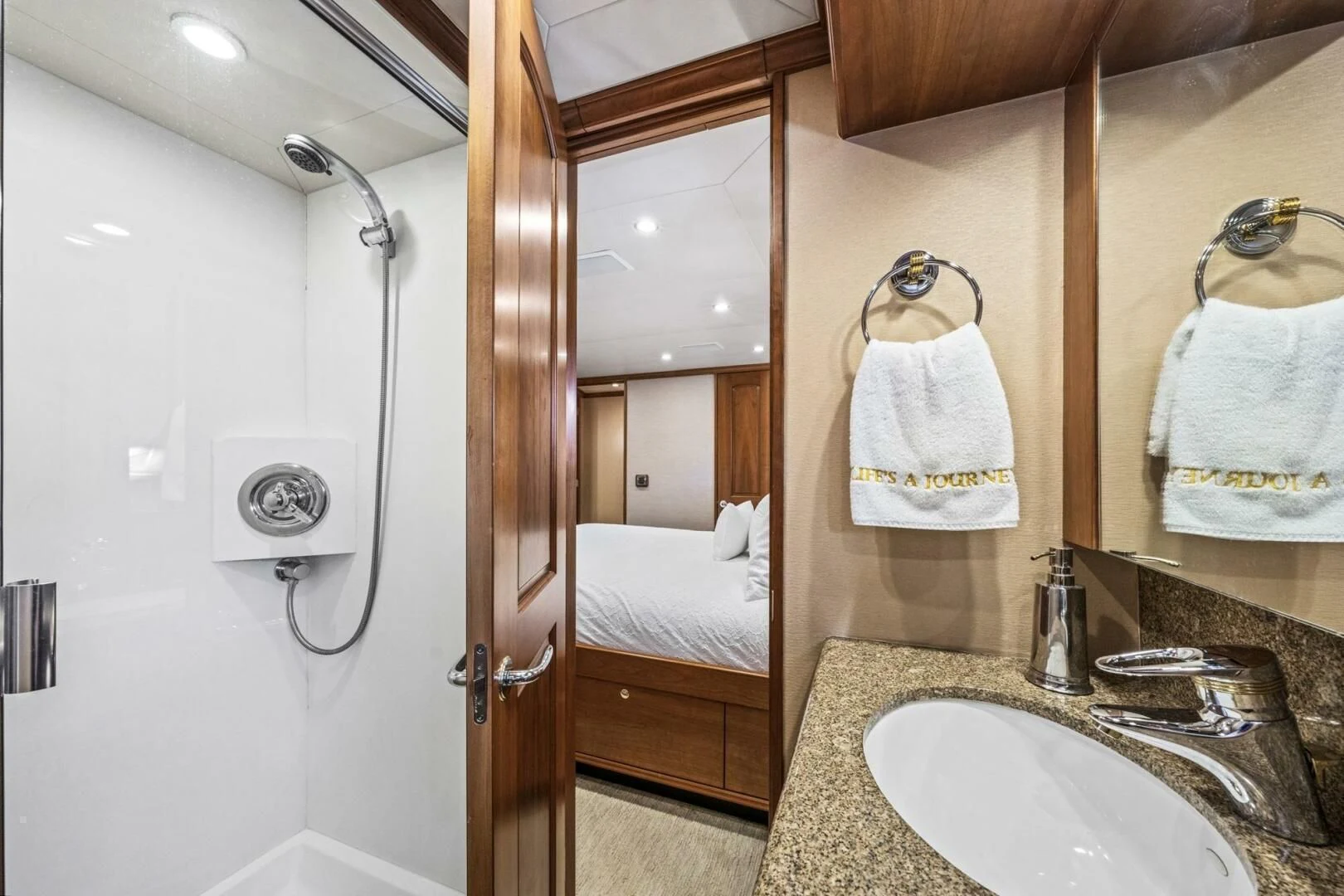 a bathroom with a sink and a shower aboard LIFE'S A JOURNEY Yacht for Sale