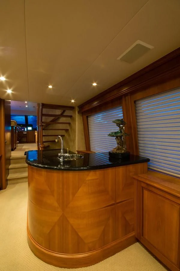 a kitchen with a countertop sink and cabinets aboard LIFE'S A JOURNEY Yacht for Sale