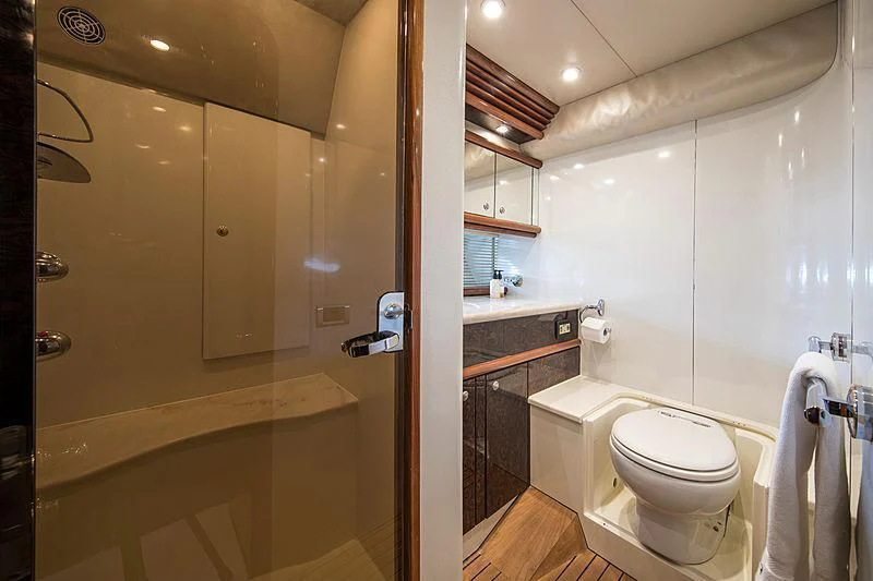 a bathroom with a toilet and a sink aboard OSCAR Yacht for Sale