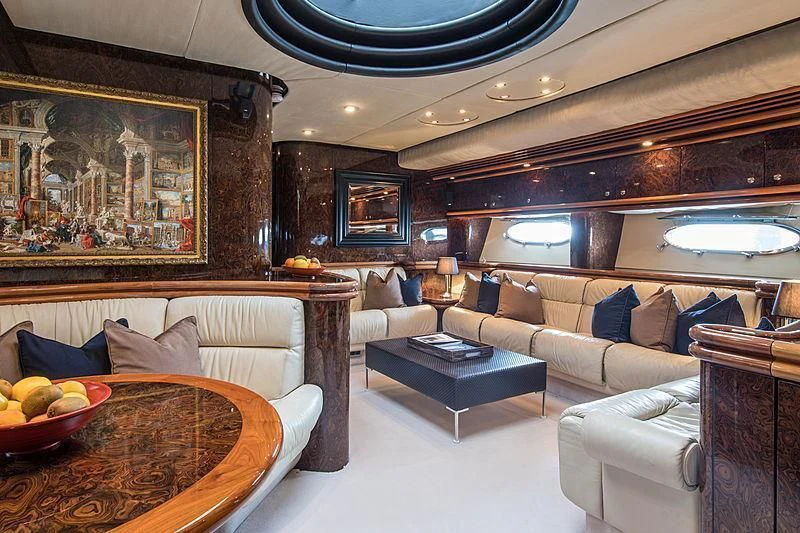 a living room with a large mirror aboard OSCAR Yacht for Sale