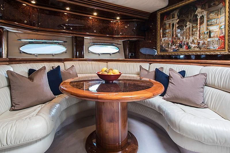a table in a room aboard OSCAR Yacht for Sale