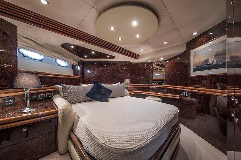a room with a bed and a piano aboard OSCAR Yacht for Sale