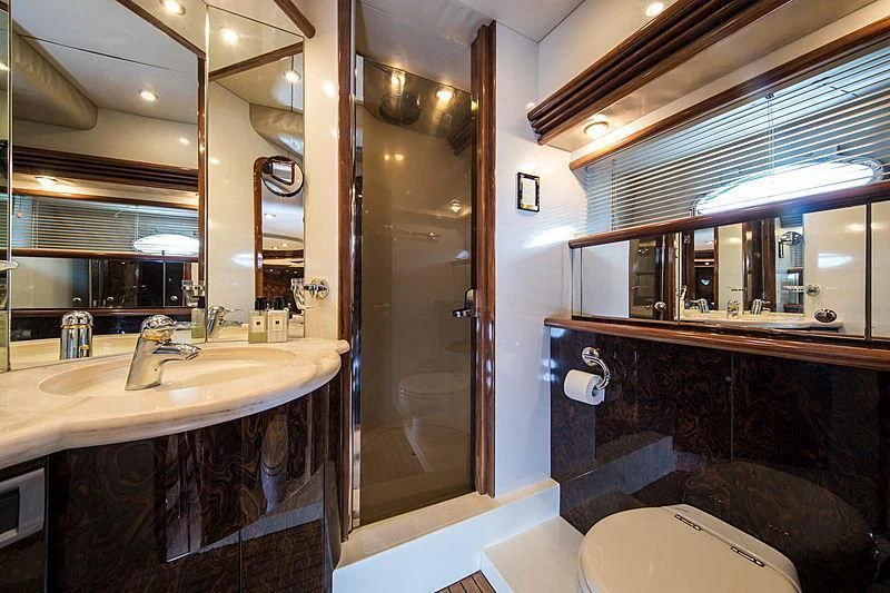 a bathroom with a large mirror aboard OSCAR Yacht for Sale