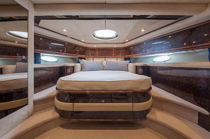 a room with couches and a bed aboard OSCAR Yacht for Sale