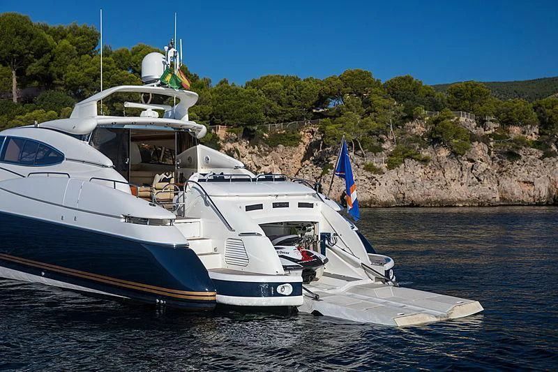 a couple of boats on the water aboard OSCAR Yacht for Sale