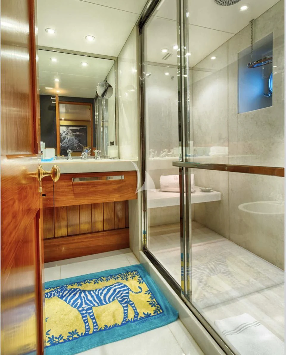 a bathroom with a glass shower aboard JURA II Yacht for Sale