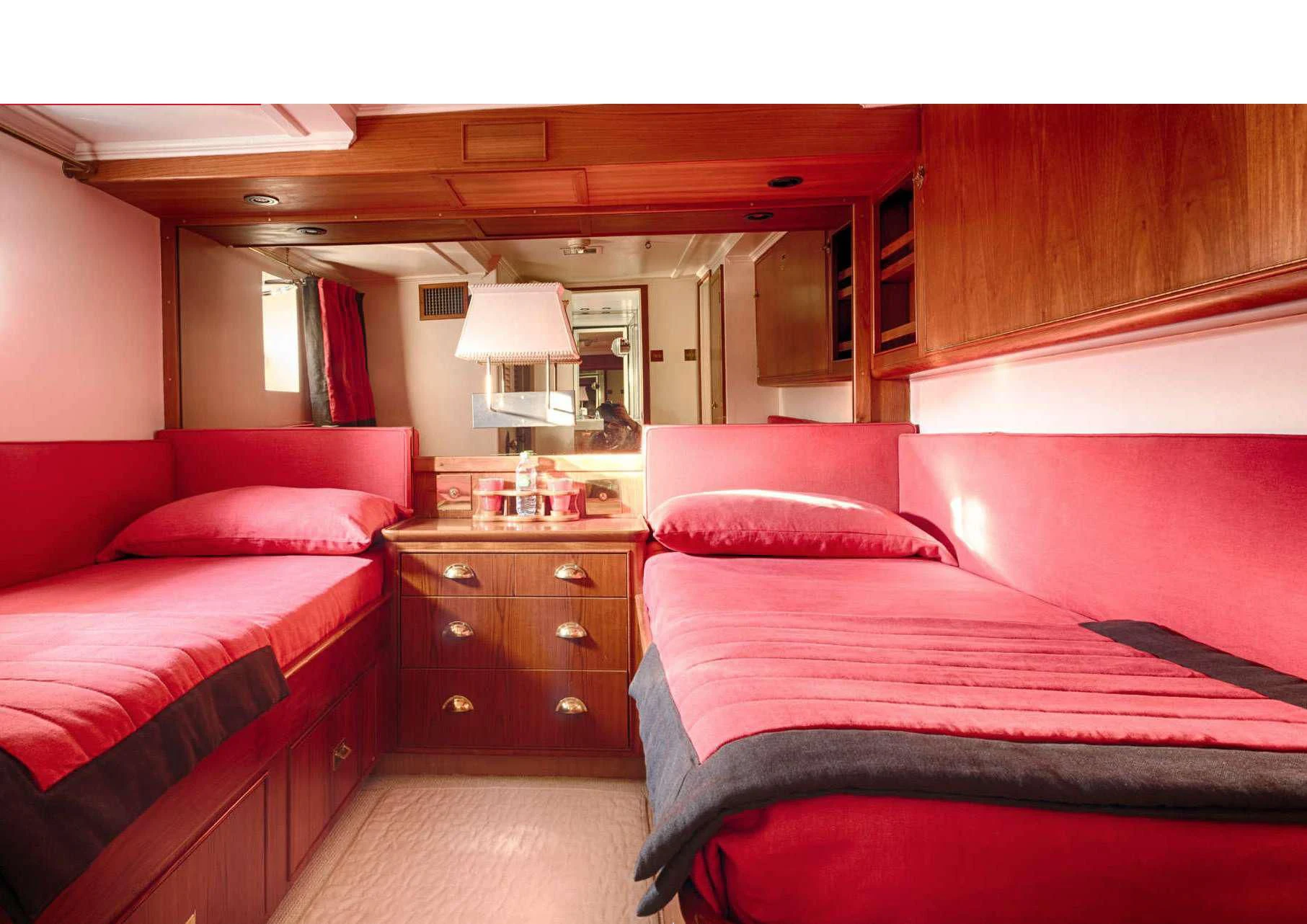 a room with two beds aboard JURA II Yacht for Sale