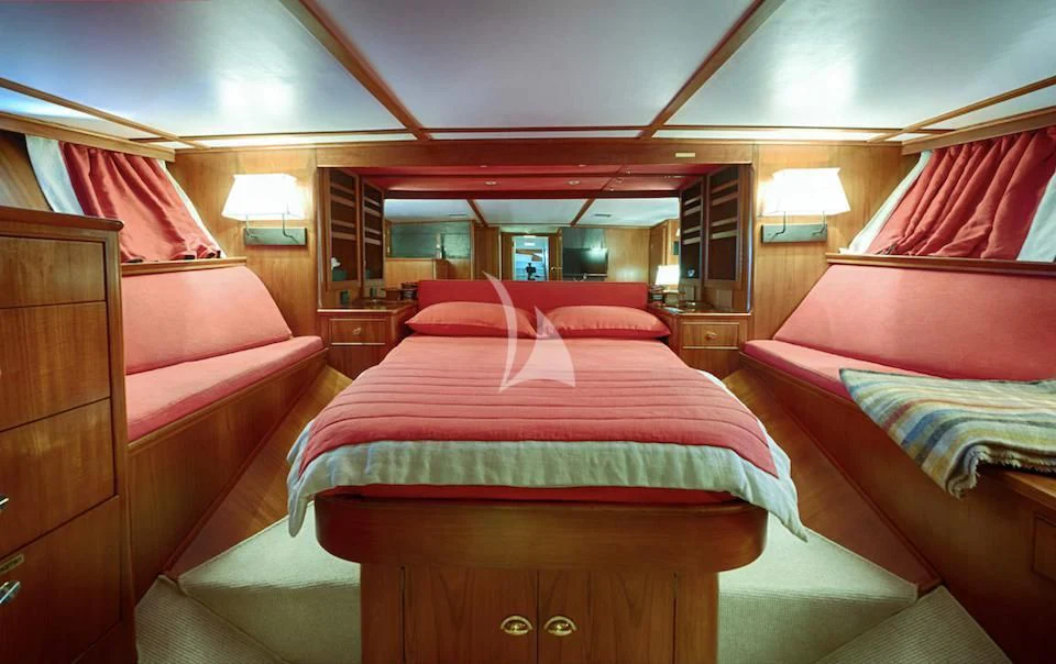 a room with a couple of beds aboard JURA II Yacht for Sale
