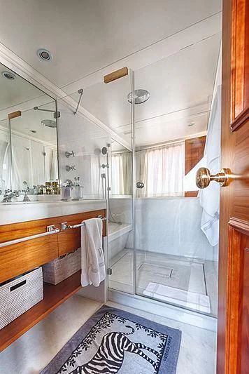 a bathroom with a shower and sink aboard JURA II Yacht for Sale