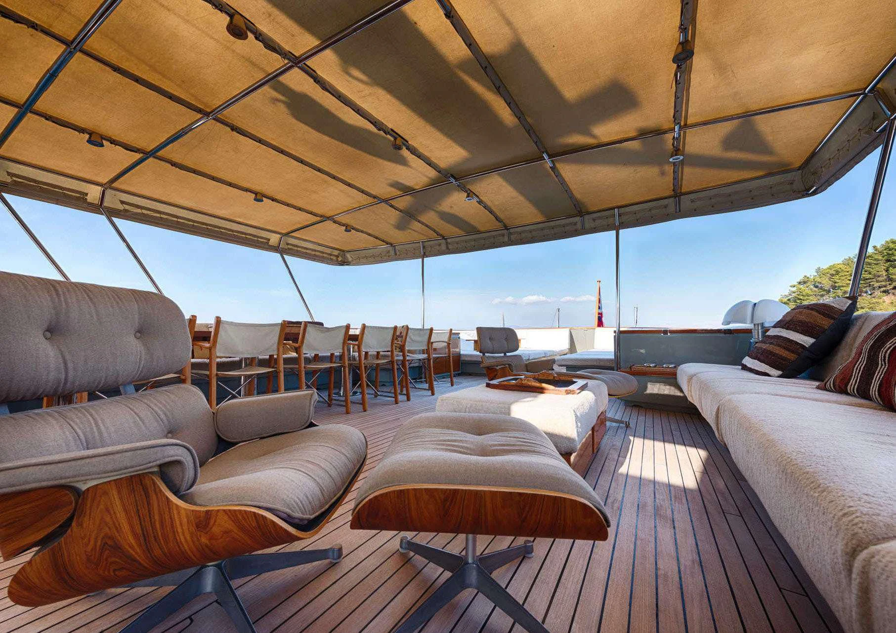 a large living room with a large patio area aboard JURA II Yacht for Sale
