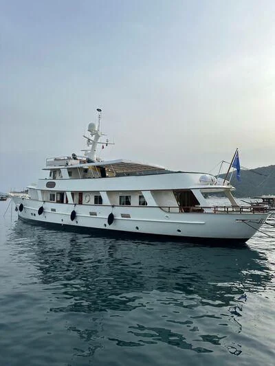 a white boat on water aboard JURA II Yacht for Sale