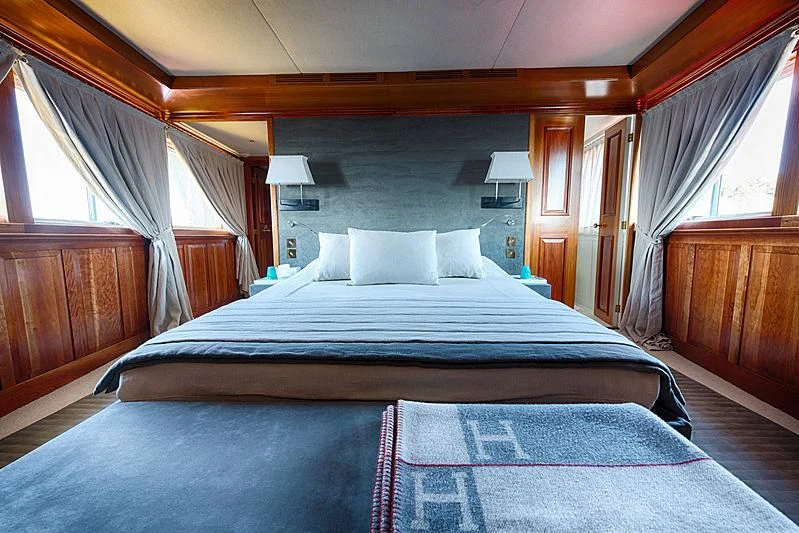 a couple of beds in a hotel room aboard JURA II Yacht for Sale