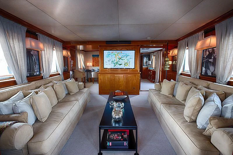 a living room with a couch and a coffee table aboard JURA II Yacht for Sale