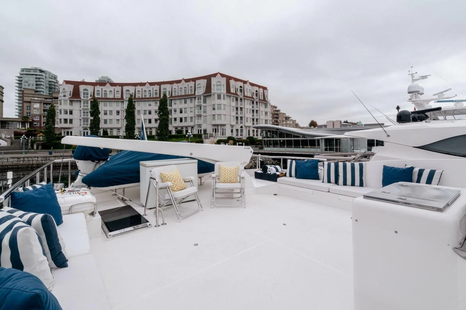 a rooftop with a group of buildings and a boat on it aboard HAPPINESS II Yacht for Sale