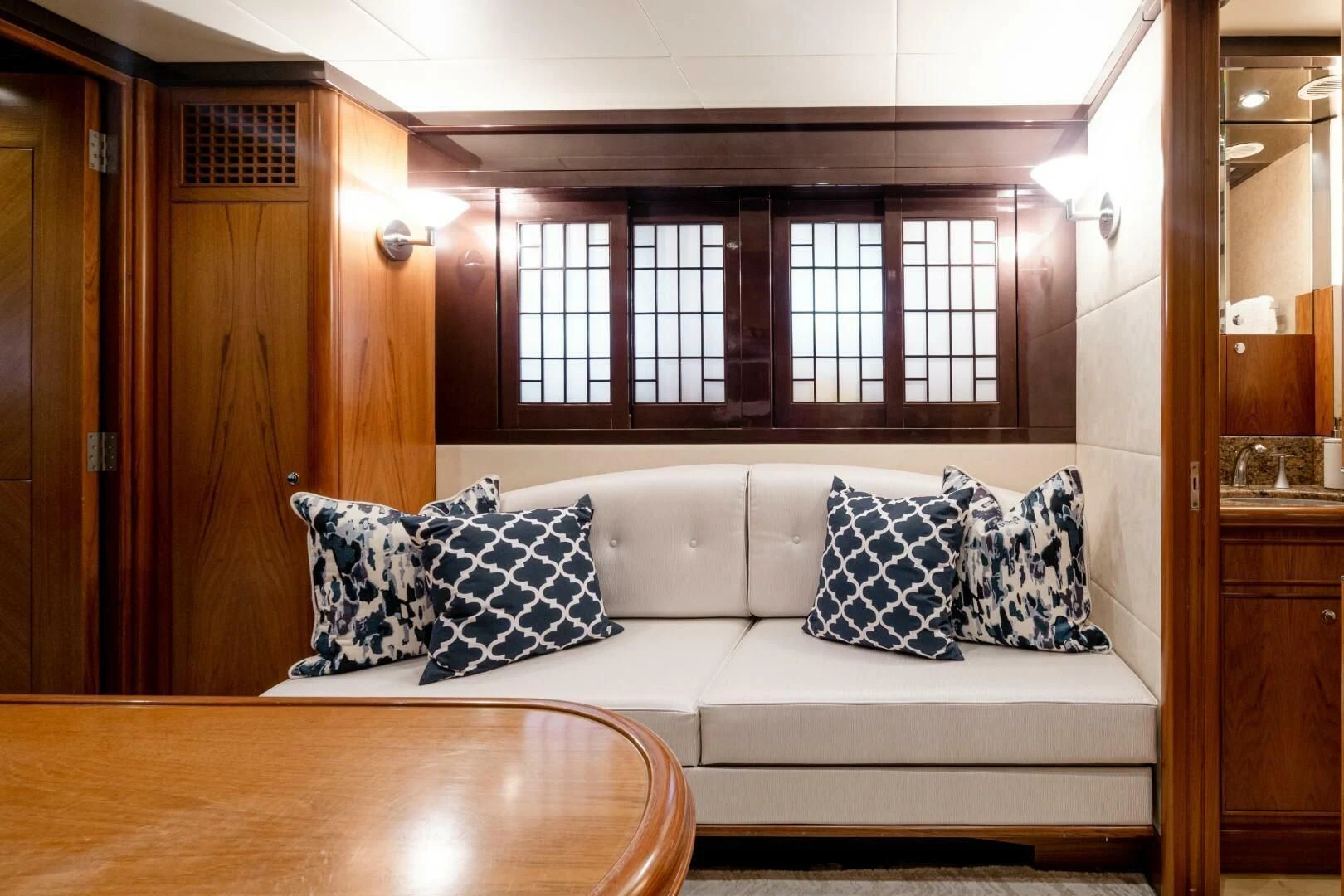 a white couch with pillows aboard HAPPINESS II Yacht for Sale
