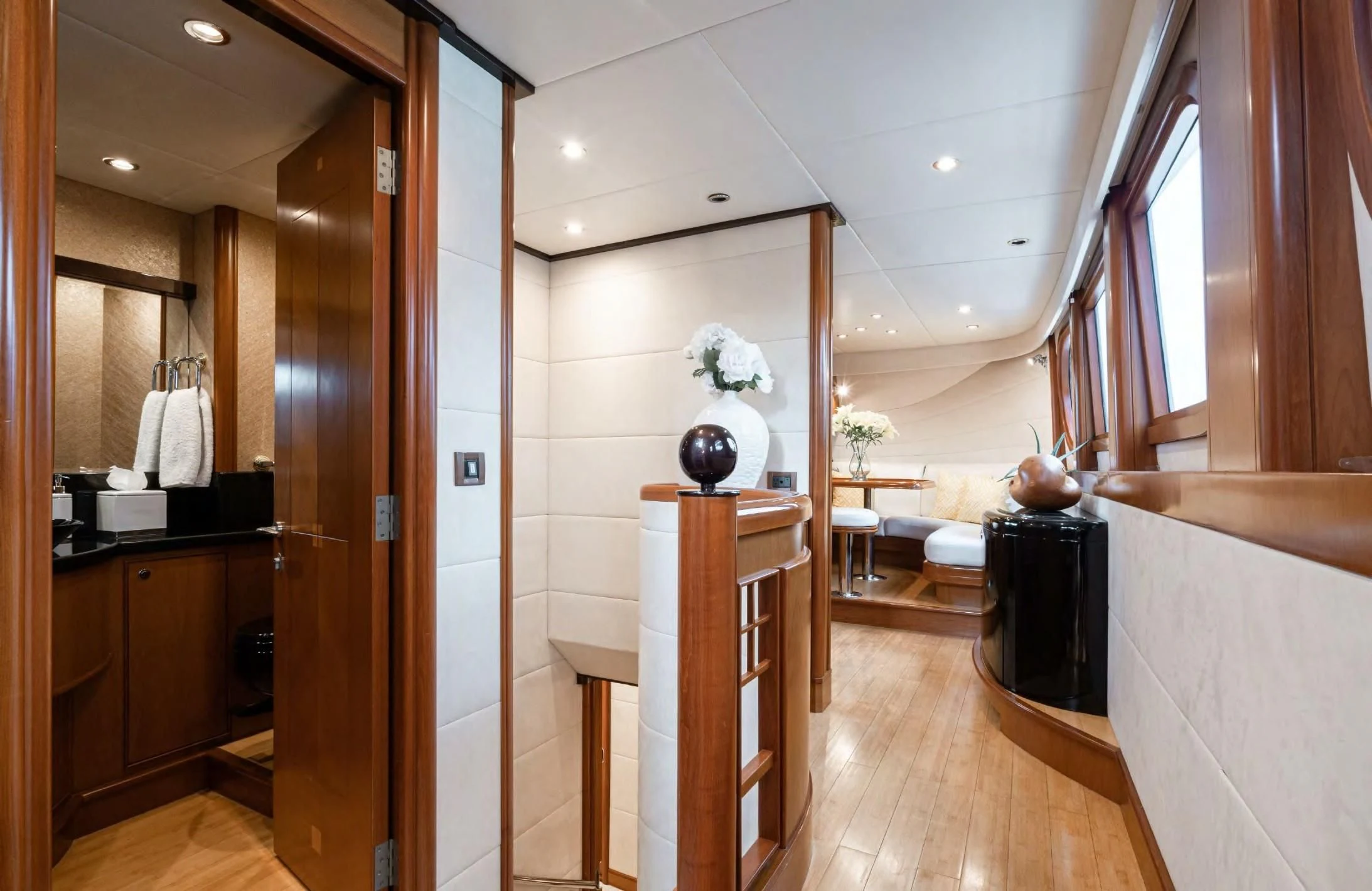 a bathroom with a wood floor aboard HAPPINESS II Yacht for Sale