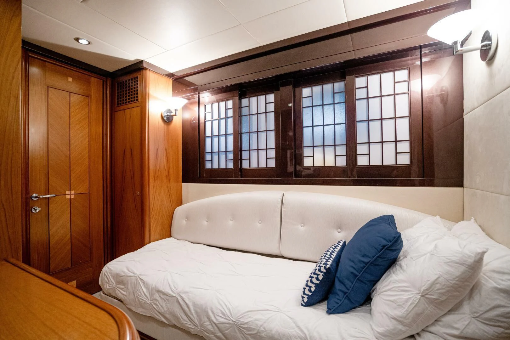 a bed with white sheets aboard HAPPINESS II Yacht for Sale