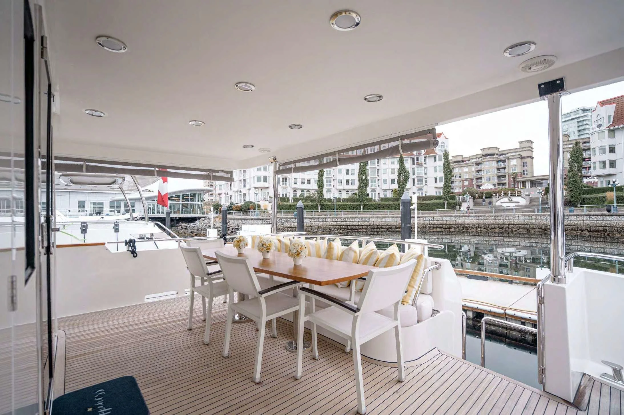 a room with tables and chairs aboard HAPPINESS II Yacht for Sale